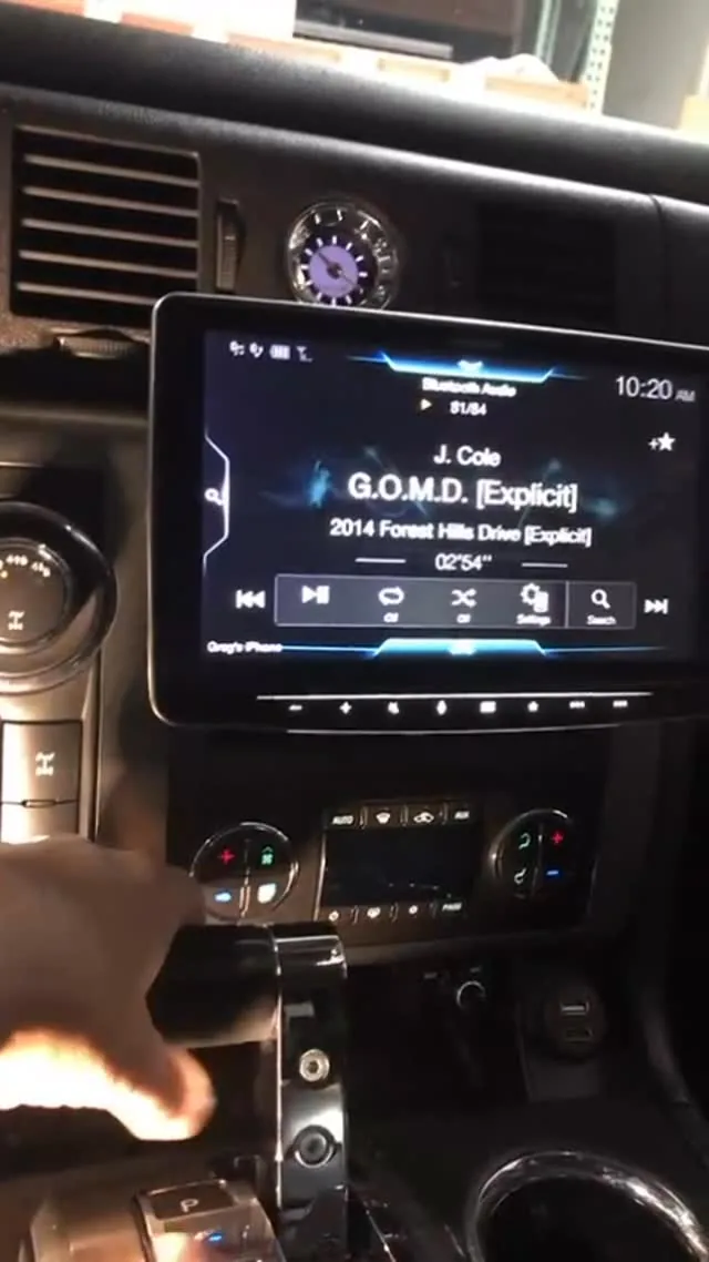 An aftermarket touchscreen installed in a vehicle dashboard