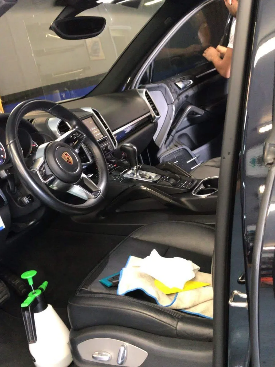 Window tint being installed on a Porsche Cayenne