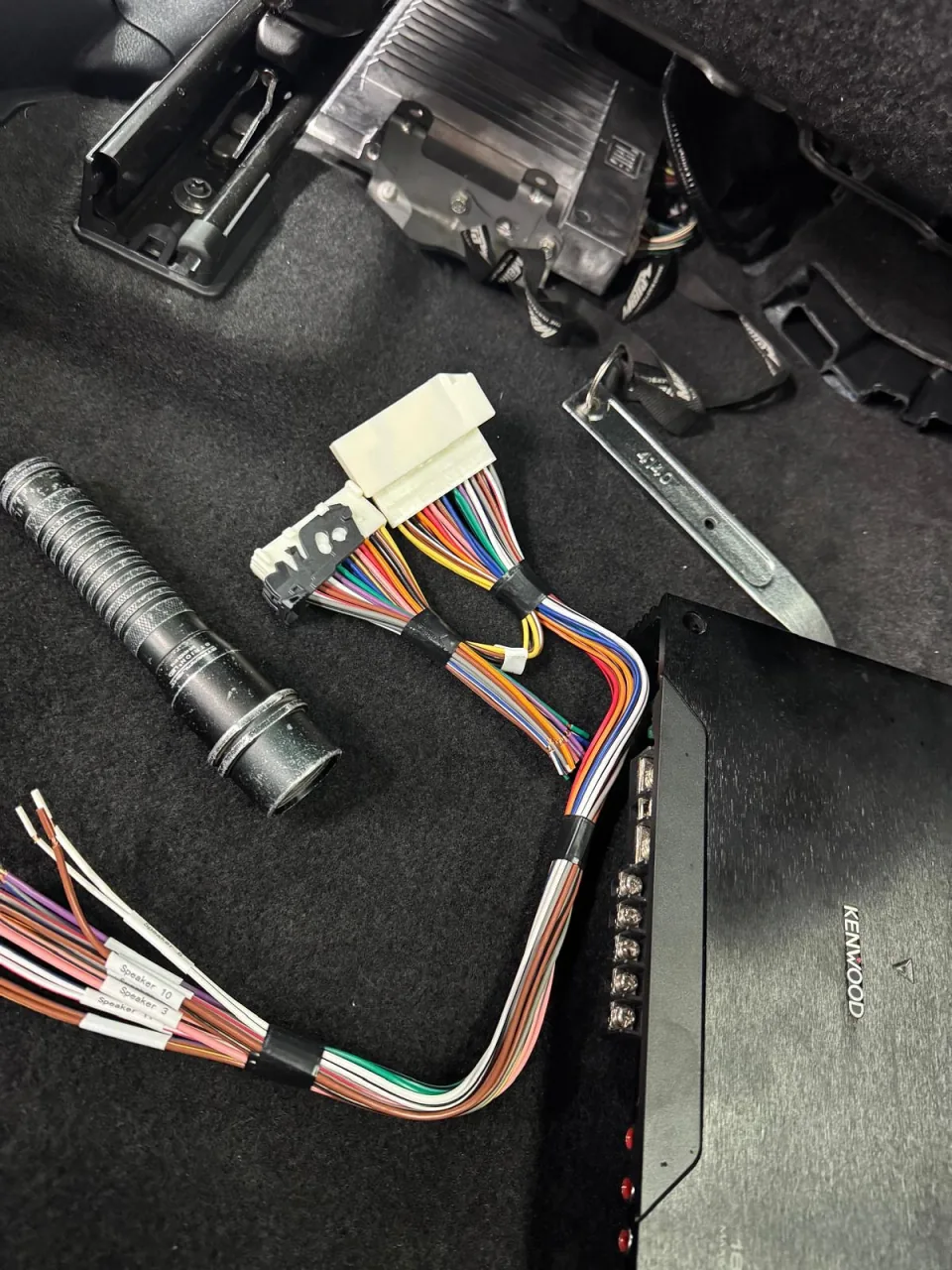 A stereo wiring harness neatly loomed before installation at Conexion