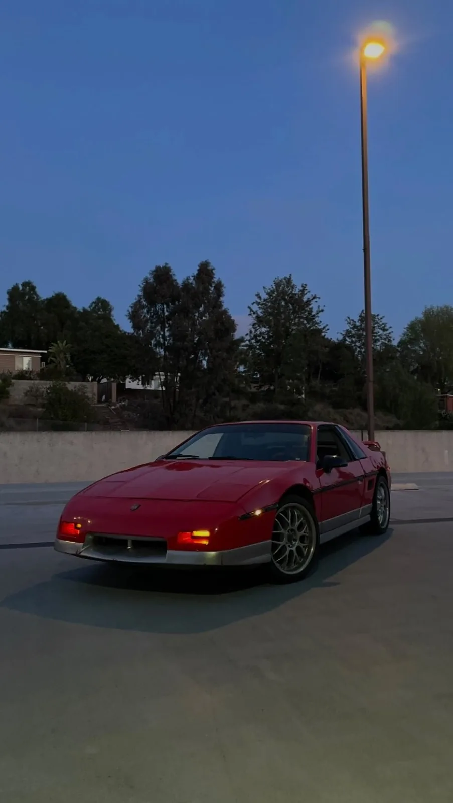 A red 1985 Pontiac Fiero GT after LED rear lights were fitted at Conexion