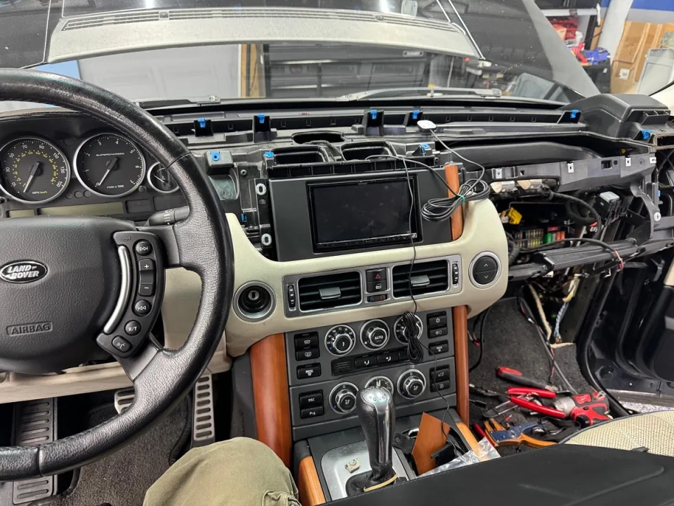 A Range Rover dashboard opened up for electrical troubleshooting